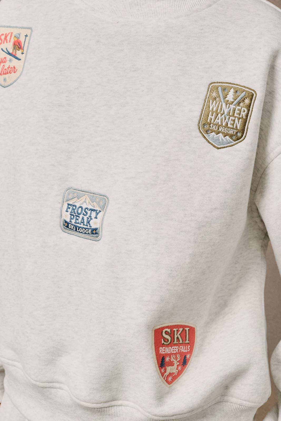 Sunday Edition by LE LIS - HIGH NECK LONG SLEEVE "SKI PATCHES" SWEATSHIRT